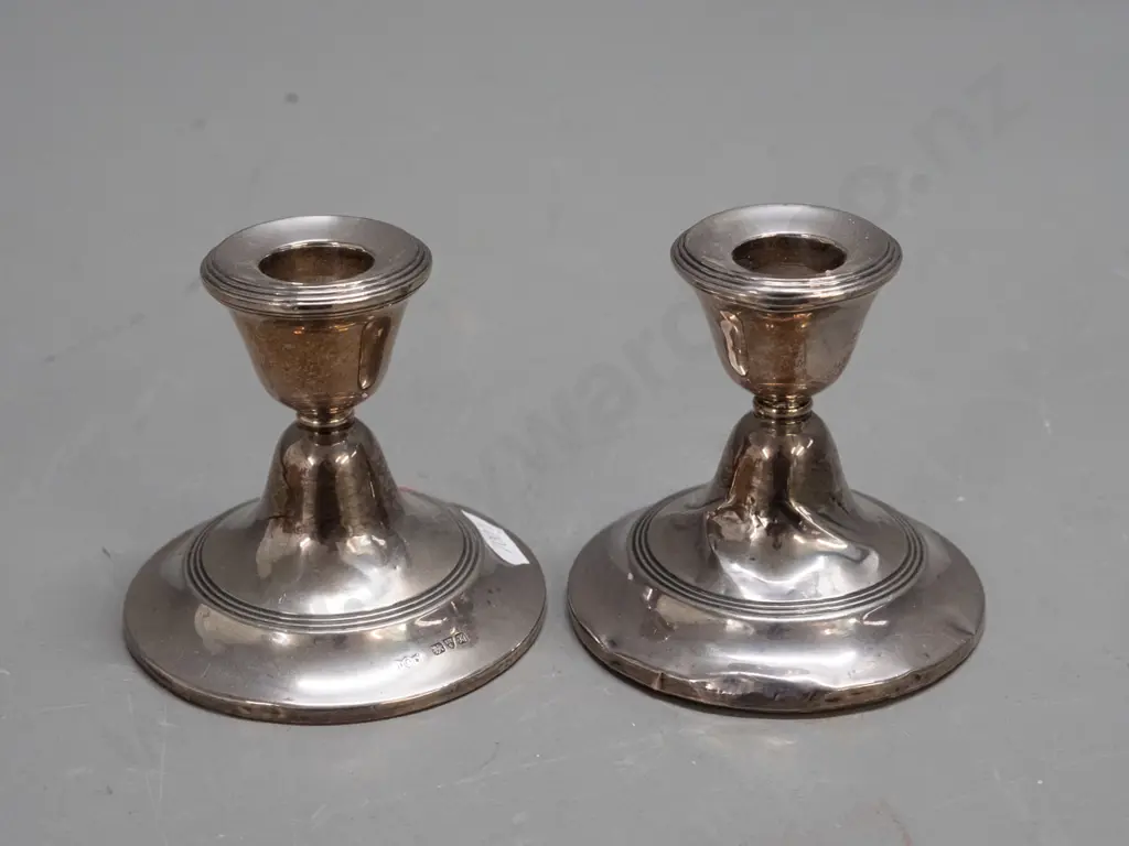 pair of sterling silver short candlesticks with oak base inserts - hallmarked inside sconces and at base - some denting Image 1++