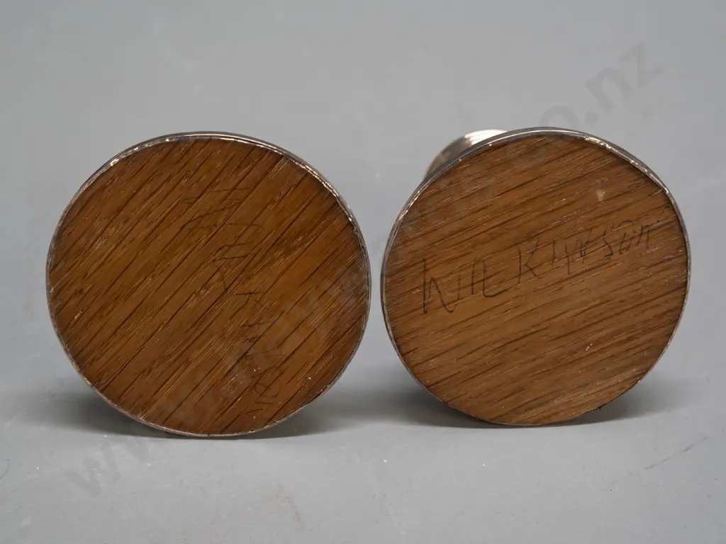 pair of sterling silver short candlesticks with oak base inserts - hallmarked inside sconces and at base - some denting Image 1++
