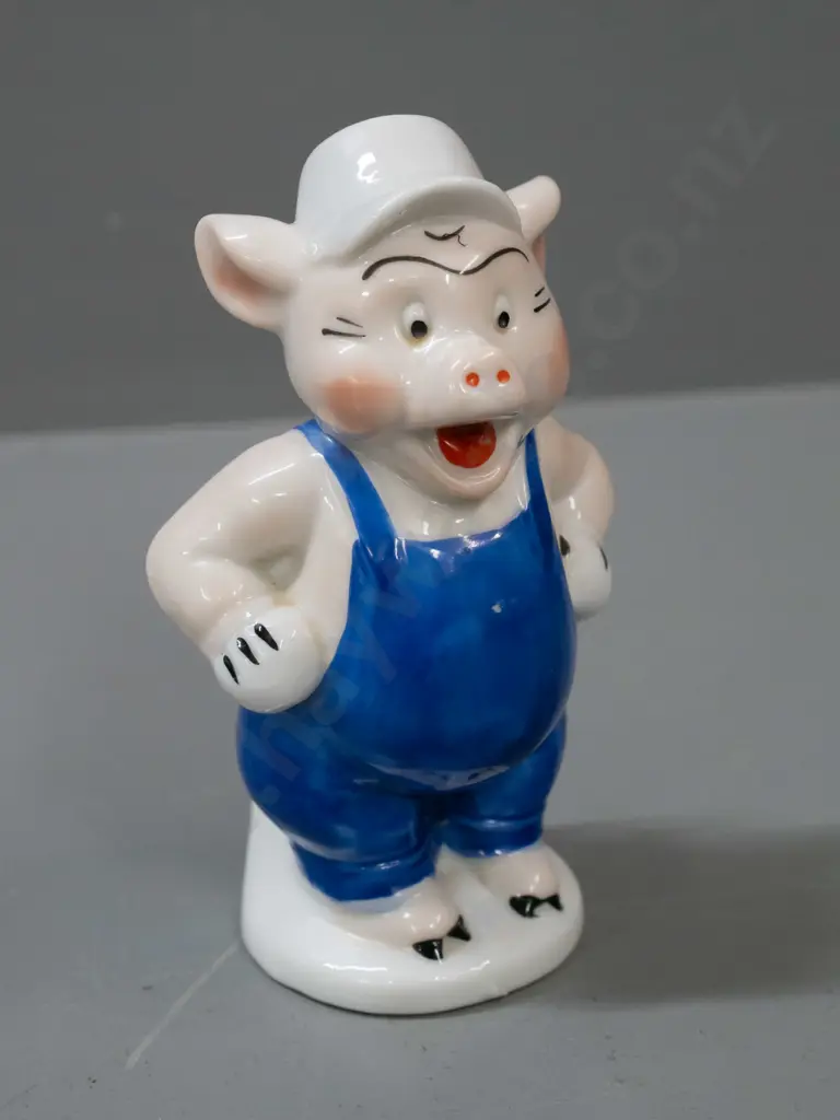 early Walt Disney little pig toothbrush holder (builder pig from the 3 Little Pigs) with chip to trowel. H-110. Image 1++