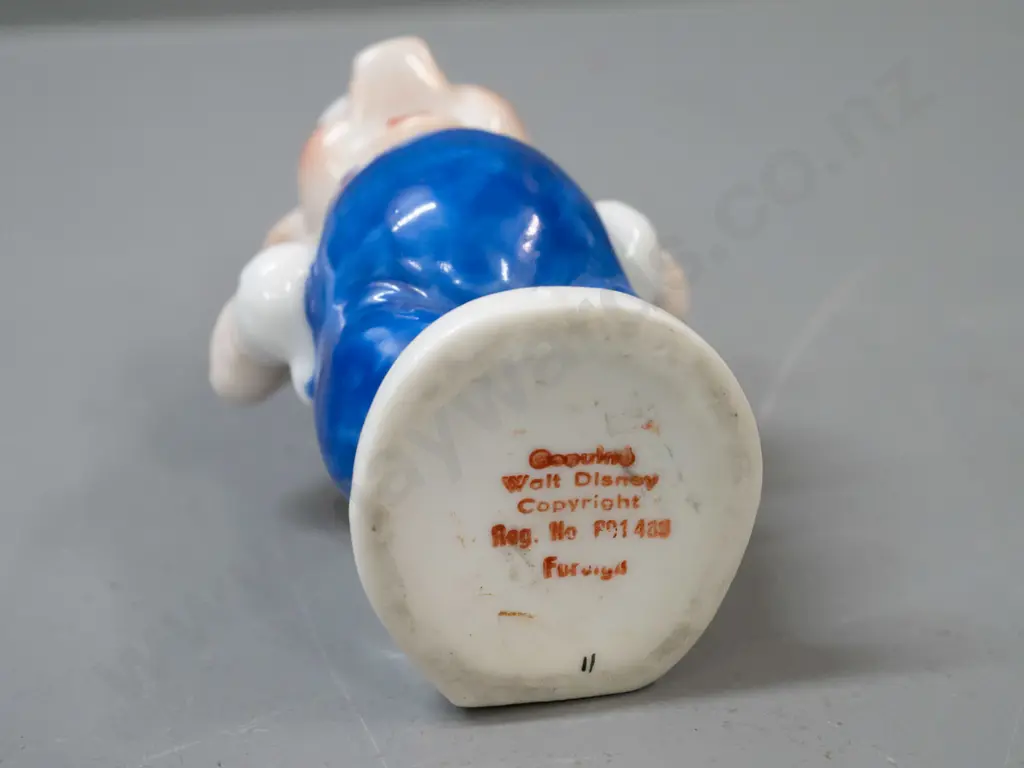 early Walt Disney little pig toothbrush holder (builder pig from the 3 Little Pigs) with chip to trowel. H-110. Image 1++