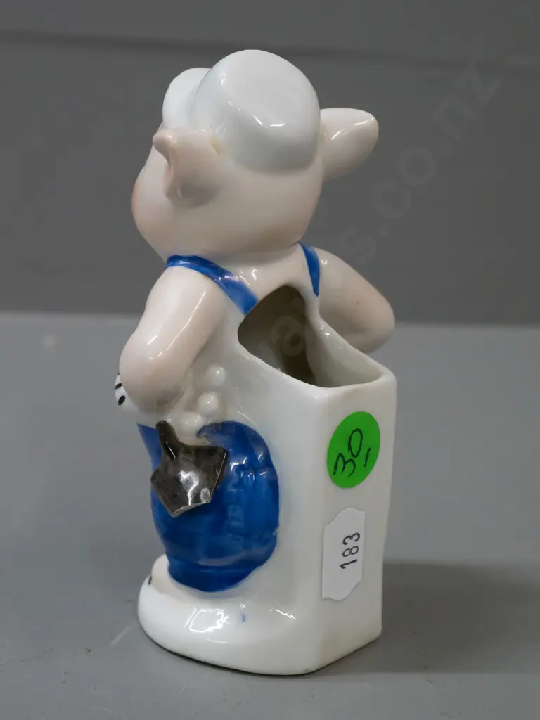early Walt Disney little pig toothbrush holder (builder pig from the 3 Little Pigs) with chip to trowel. H-110. Image 1++