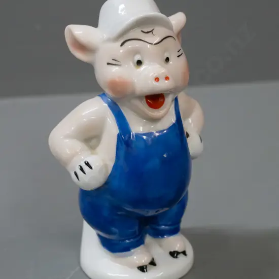 early Walt Disney little pig toothbrush holder (builder pig from the 3 Little Pigs) with chip to trowel. H-110.