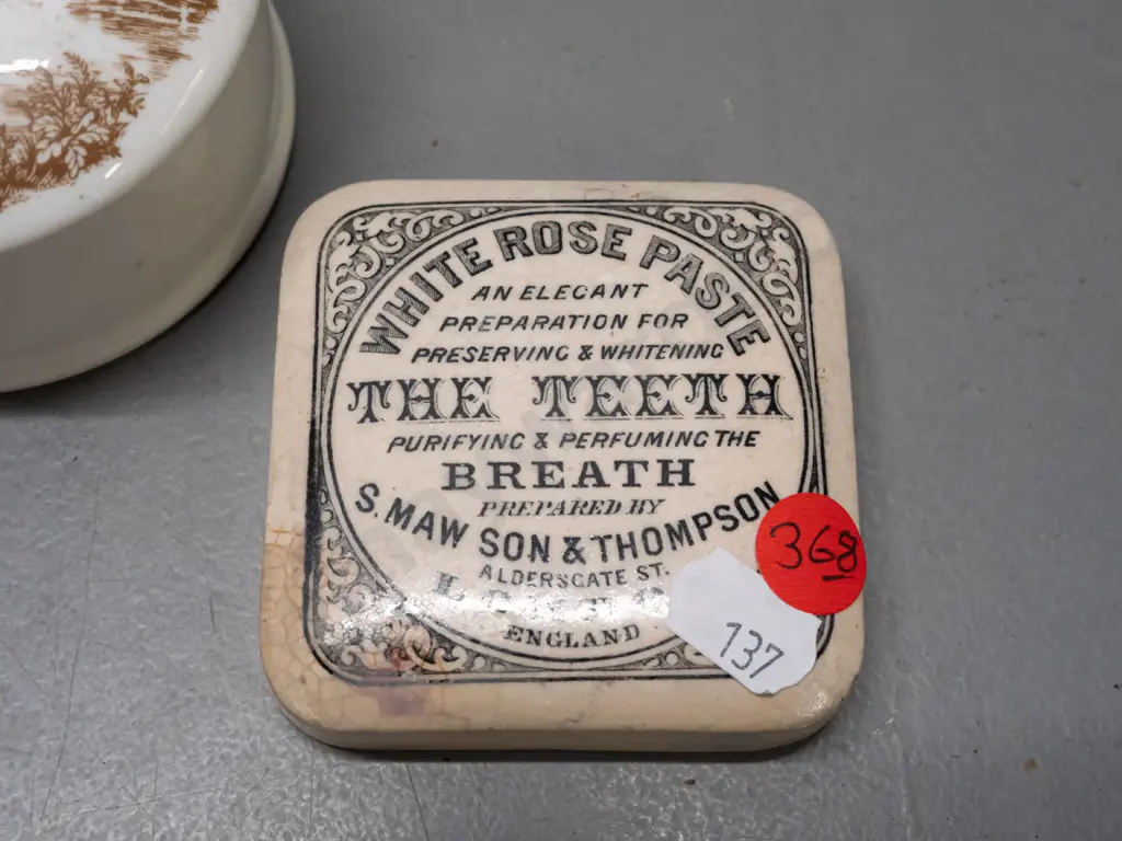 2 English toothpaste lids - White Rose and Wood's Areca Nut - and a lidded canister with fishing scene on lid, marked Image 1++