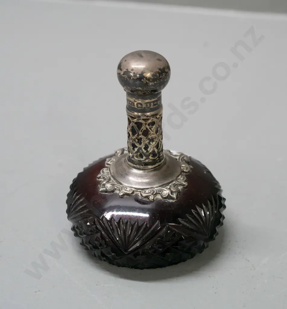 vintage ruby cut glass scent bottle with hallmarked sterling silver pierced collar and lid, small glass stopper. Image 1++