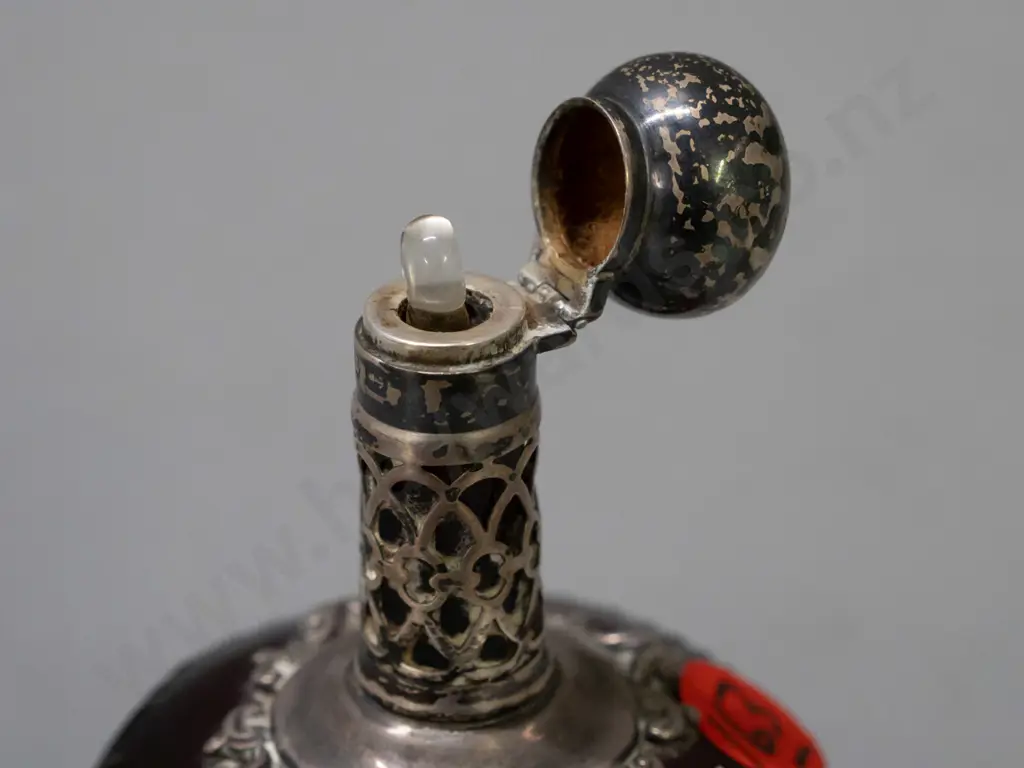 vintage ruby cut glass scent bottle with hallmarked sterling silver pierced collar and lid, small glass stopper. Image 1++