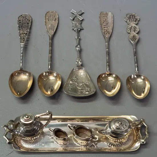 miniature silver plated tea set on tray, and assorted small asian spoons, may be unmarked silver, one marrked Shanghai,