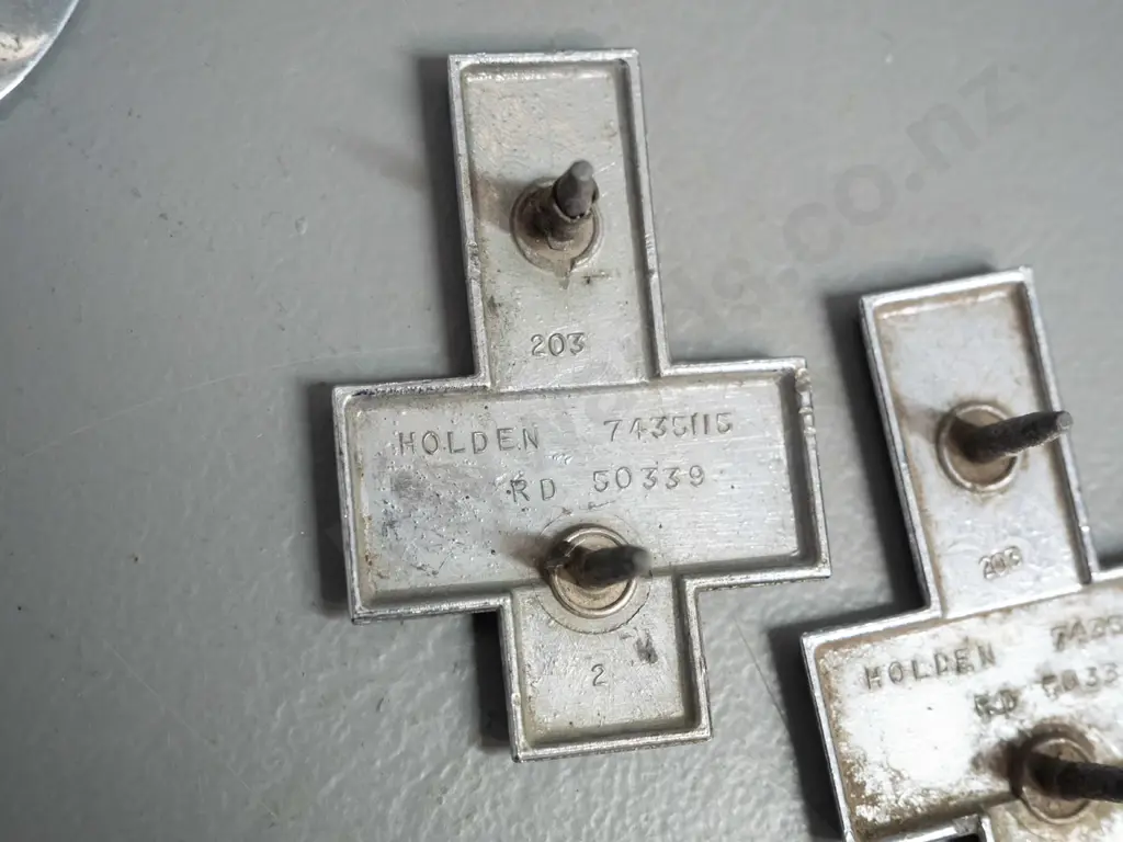 assorted car badges - 2 AA badges, one with AA AUckland markings, Holden 186, V8, Morris Minor Dunedin 2000 convention Image 1++