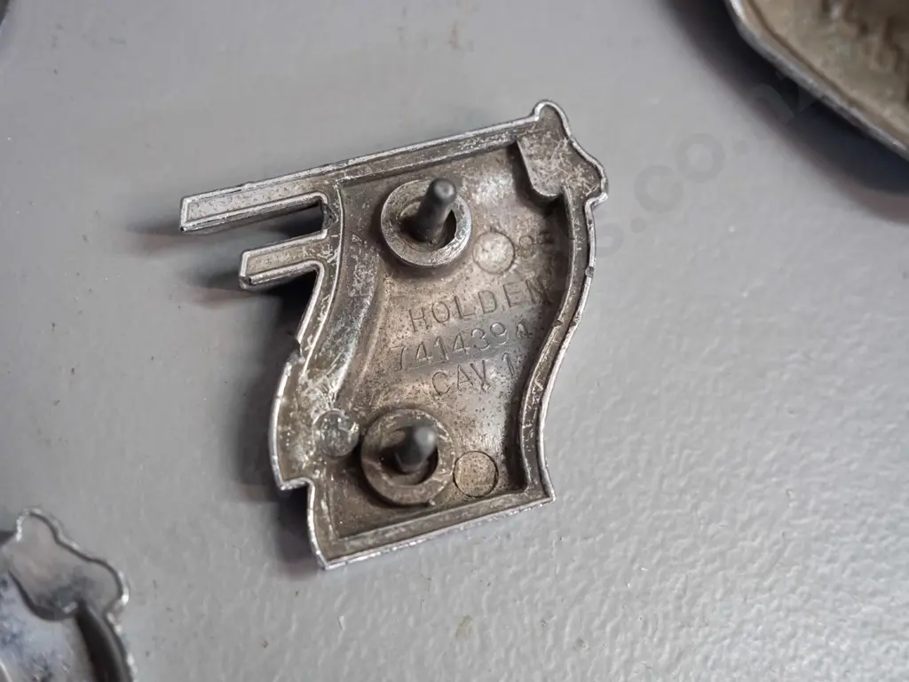 assorted car badges - 2 AA badges, one with AA AUckland markings, Holden 186, V8, Morris Minor Dunedin 2000 convention Image 1++