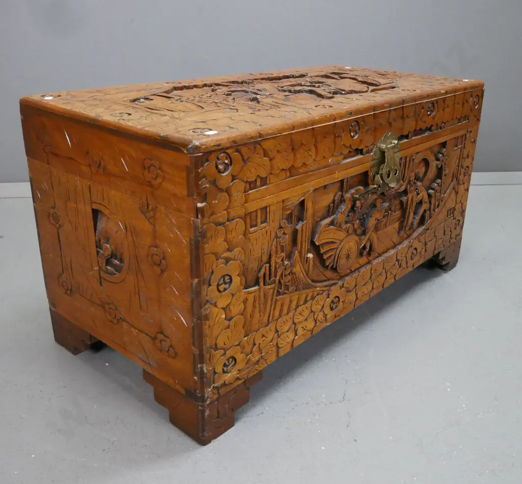 Chinese carved camphorwood chest with brass latch and lock - shrinkage of top on front edge, chip to carving on front Image 1++