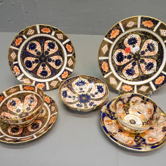 4 pieces Royal Crown Derby imari pattern items - trio, cup & saucer, side plate, dish, all in varying imari styles,