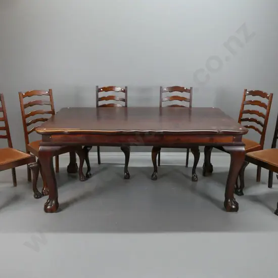 mid-century continental style walnut and fruitwood dining table with shaped edge to top, large sweeping cab legs on ball