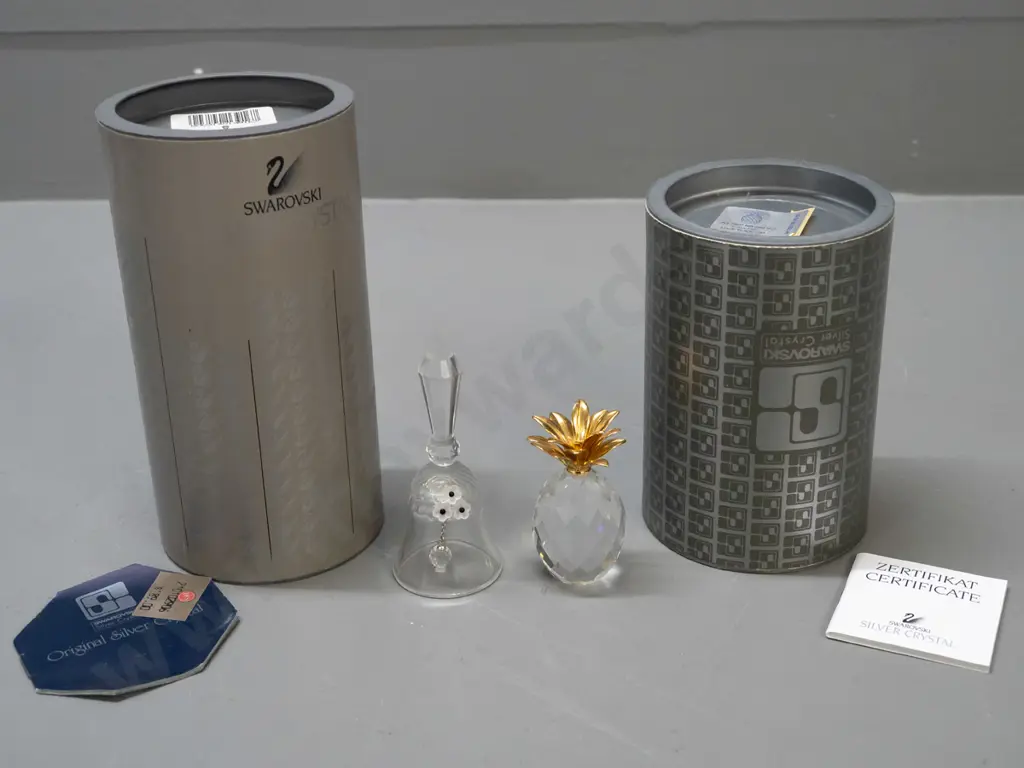 2 Swarovski crystal ornaments - bell with applied flowers and pineapple with gilded leaf top, both with original boxes. Image 1++