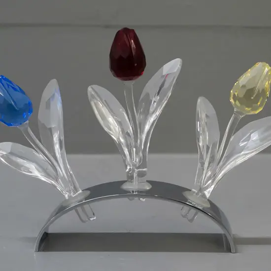 3 Swarovski crystal tulips in curved chrome stand, 3 original boxes. H-115 W-100