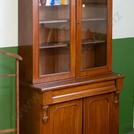 Victorian mahogany bookcase-chiffonier with 2 arched glazed doors, 3 adjustable shelves, shaped cornice top, base has