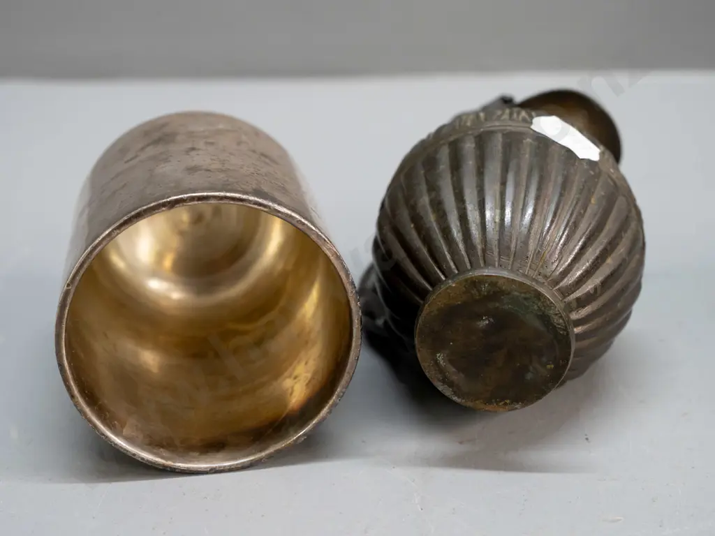 small cylindrical cast metal bell, no ringer, and a heavy cast brass urn jug with figural handle with bronze patina Image 1++