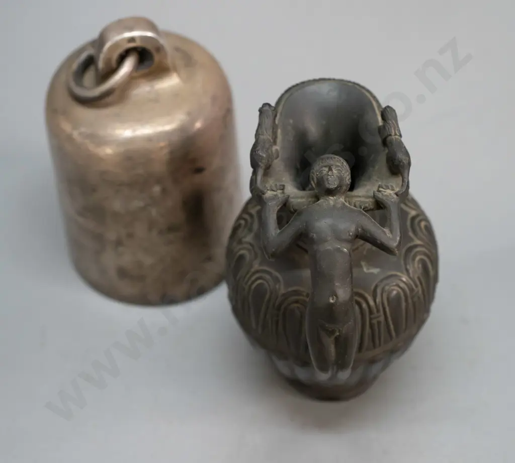 small cylindrical cast metal bell, no ringer, and a heavy cast brass urn jug with figural handle with bronze patina Image 1++