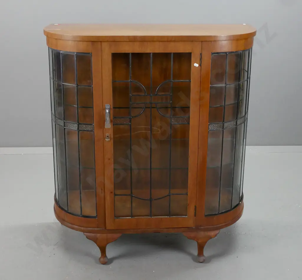 vintage art deco walnut veneer bow-front china cabinet on short cab legs, with geometric leadlight doors, 2 fixed glass Image 1++
