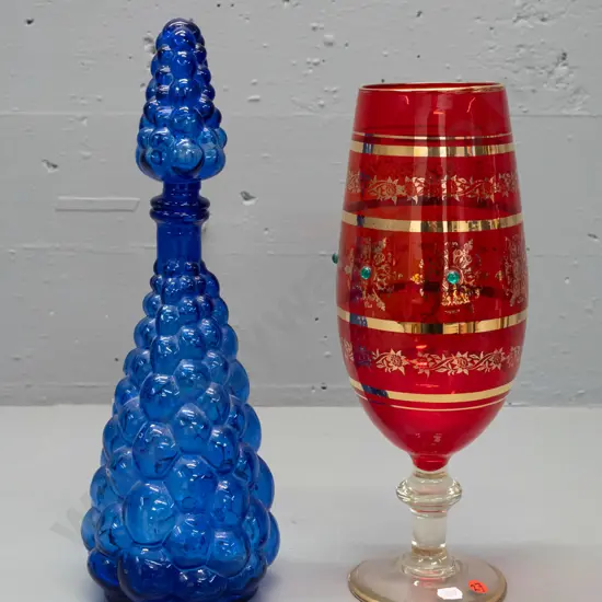 2 retro glass items - moulded stoppered bubble bottle and a large red & clear goblet with gilt decoration, one