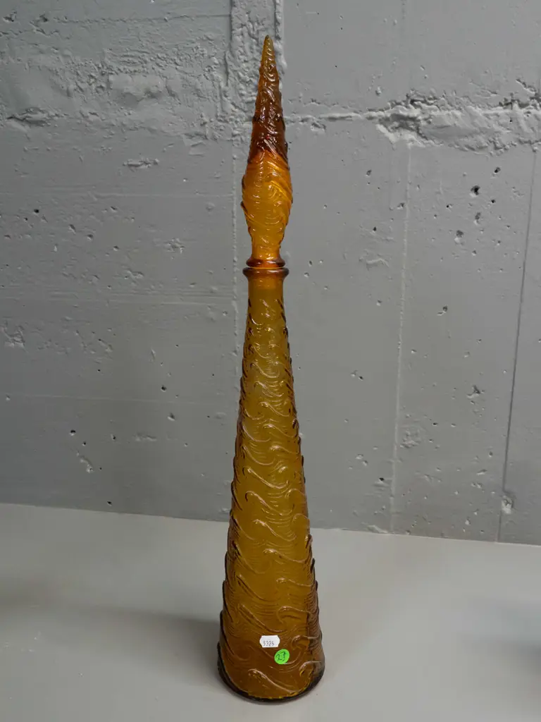 moulded amber glass stoppered genie bottle with wave design, 'Made in Italy' stamped in base - powdery white residue Image 1++