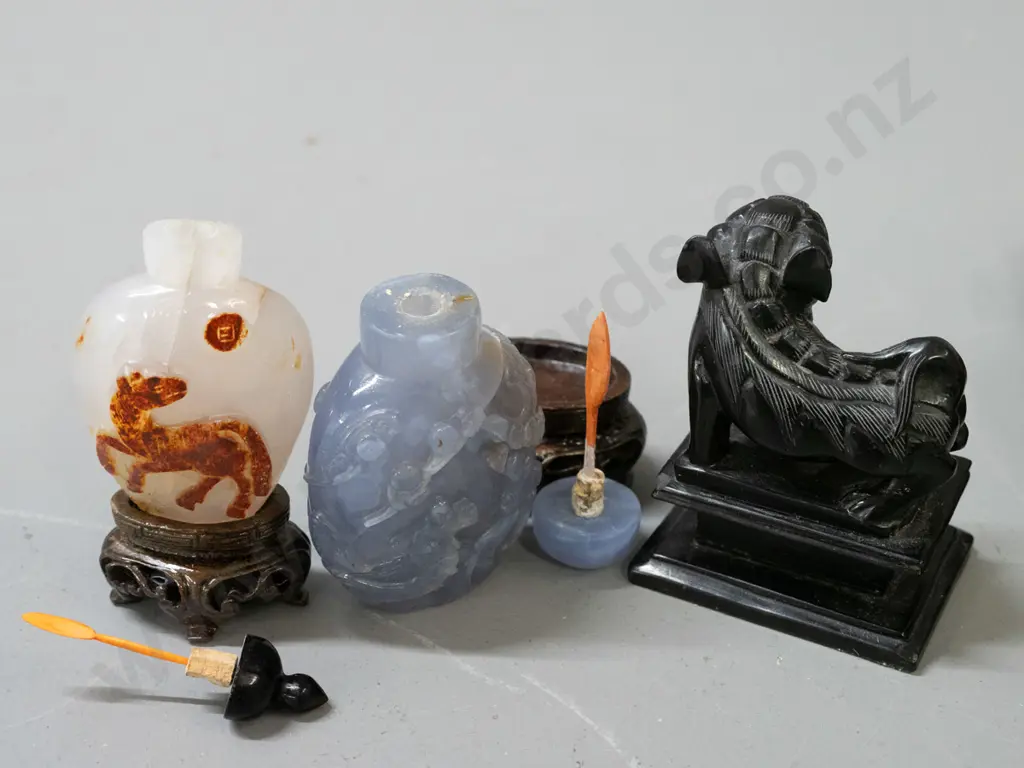 Chinese carved wooden figure of woman with scroll, small black stone or faux stone foo dog and 2 scent bottles on stands Image 1++