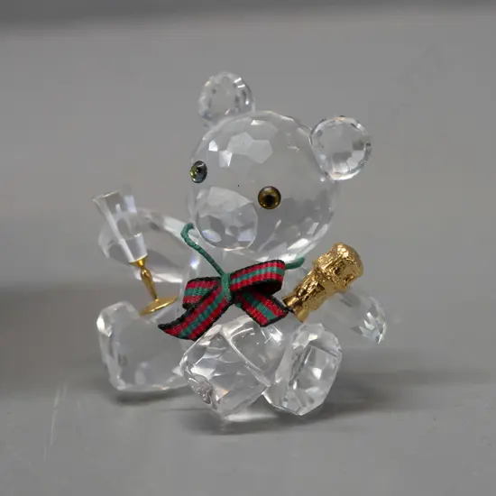Swarovski crystal cased Teddy bear with champagne bottle, striped ribbon scarf, with original box. H-45