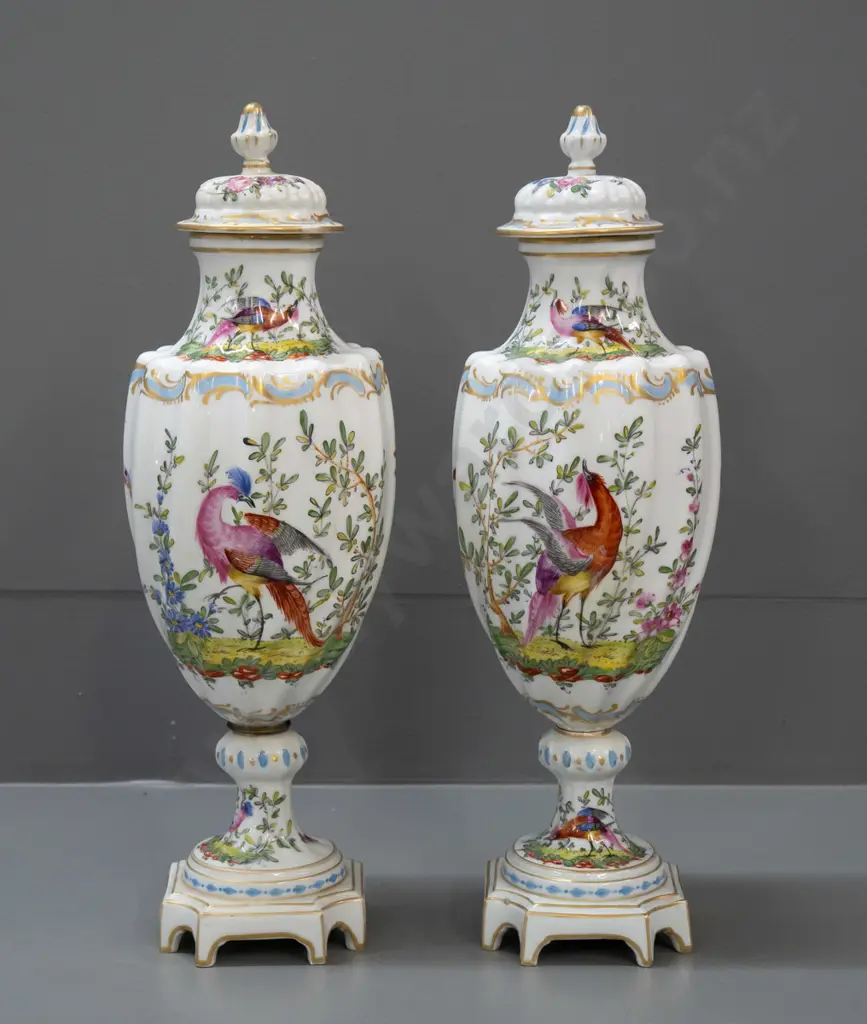 pair of Chelsea pottery hand painted and gilded bird motif lidded urns on platform base, swirled fluted body shape Image 1++