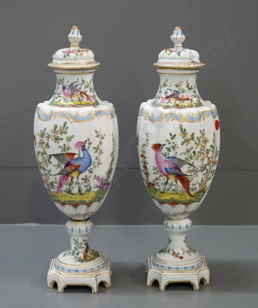 pair of Chelsea pottery hand painted and gilded bird motif lidded urns on platform base, swirled fluted body shape Image 1++