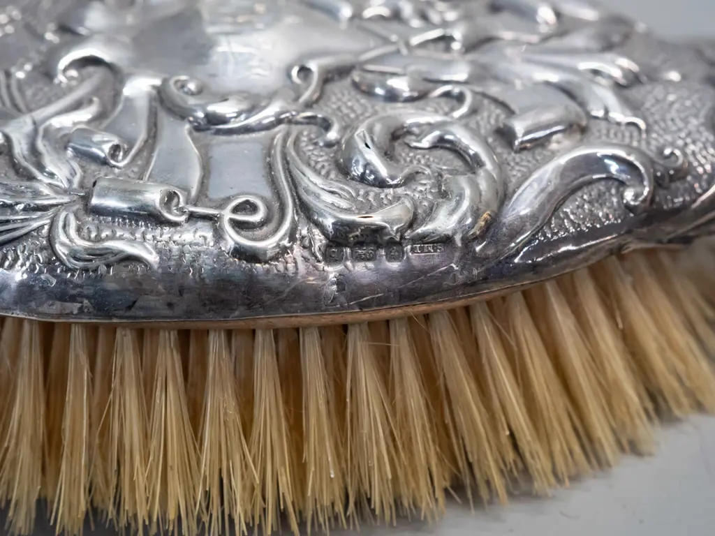 sterling silver dressing table items - 2 sterling mounted cut glass scent bottles, hair brush and miniature Image 1++