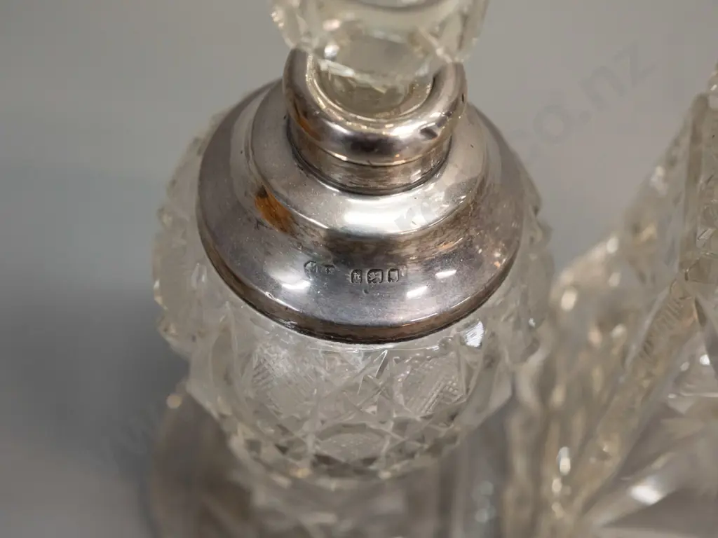 sterling silver dressing table items - 2 sterling mounted cut glass scent bottles, hair brush and miniature Image 1++