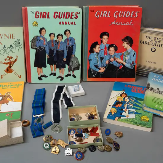 collection of Girl Guide and Brownie publications, badges and ribbons