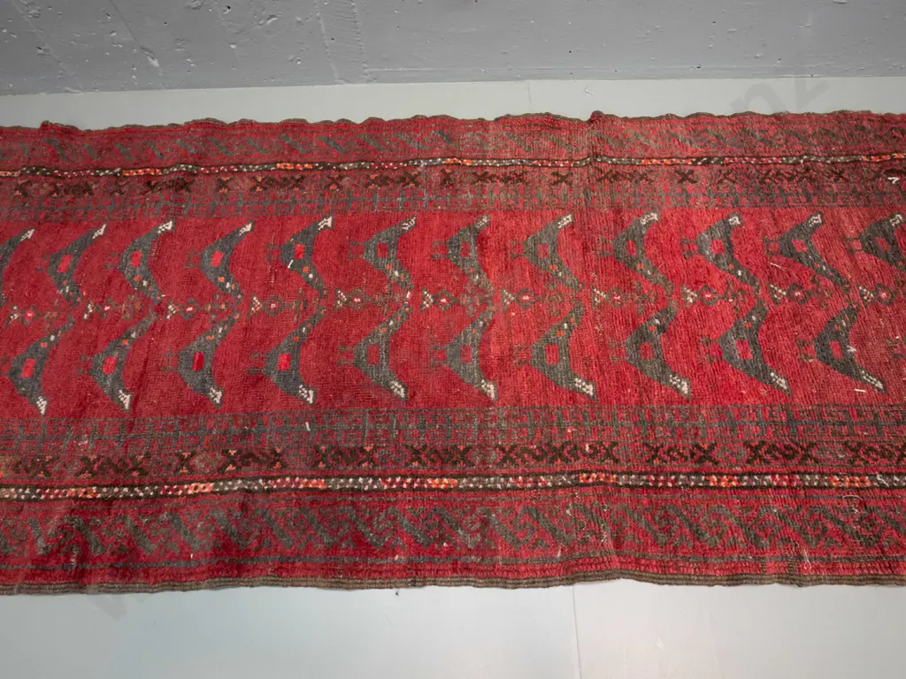 hand-knotted wool floor rug with tribal style bird motifs - some wear and colour variation L-2520 W-680 Image 1++