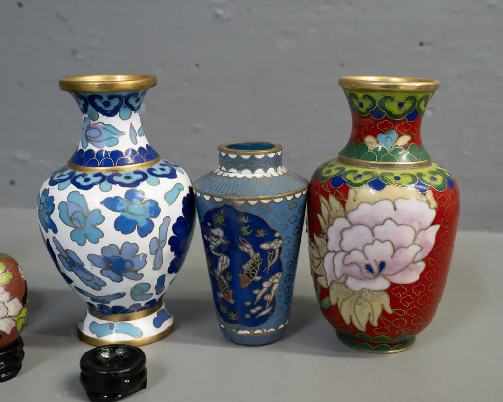 6 assorted small Chinese cloisonne vases, 4 with stands, and 2 miniature eggs on stands. Largest vase H-110. Image 1++