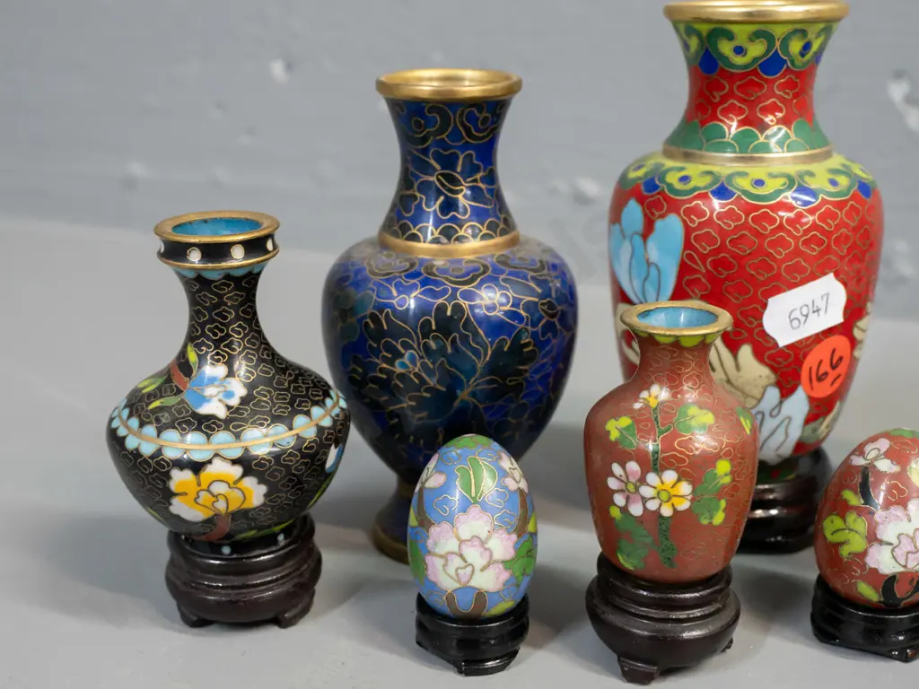 6 assorted small Chinese cloisonne vases, 4 with stands, and 2 miniature eggs on stands. Largest vase H-110. Image 1++
