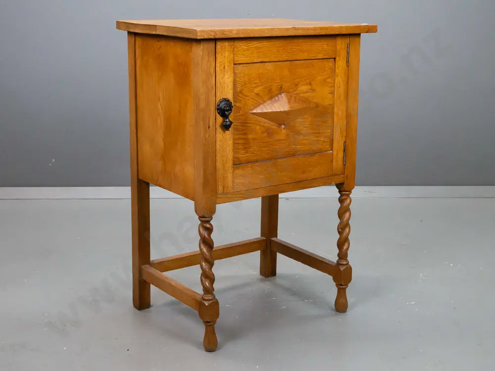 vintage oak bedside / pot cupboard with panelled door, inner shelf, applied diamond shaped decoration, Jacobean twist Image 1++