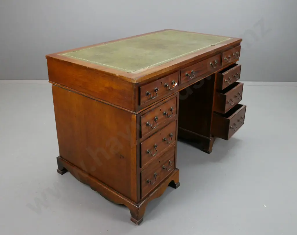 double pedestal oak and mahogany veneer Chippendale style desk with green leather, gold tooled top. Image 1++