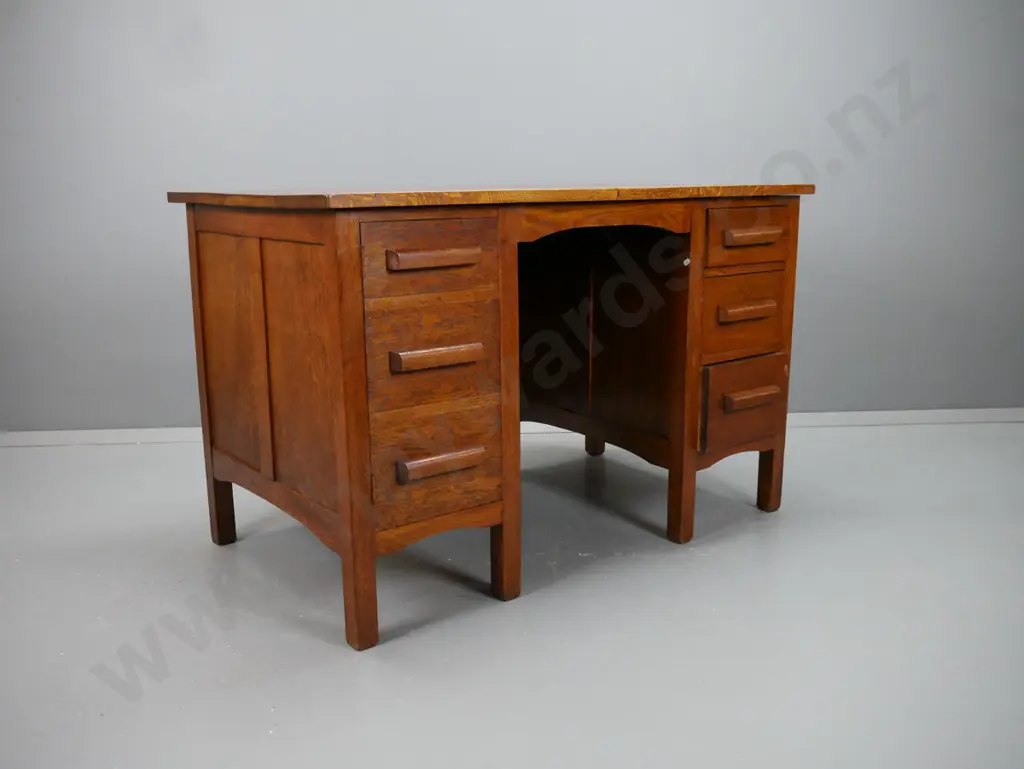 vintage oak double pedestal desk with panelled sides and kneehole, 3 kauri lined drawers on right, door with dummy Image 1++