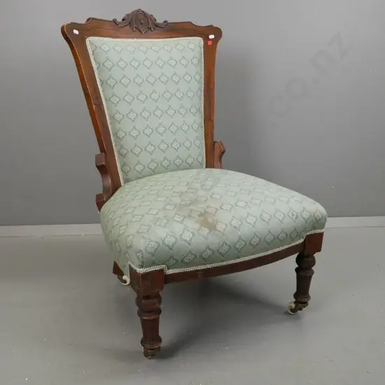 Victorian walnut and beech lady's chair with turned and fluted front legs, white porcelain and brass casters - staining