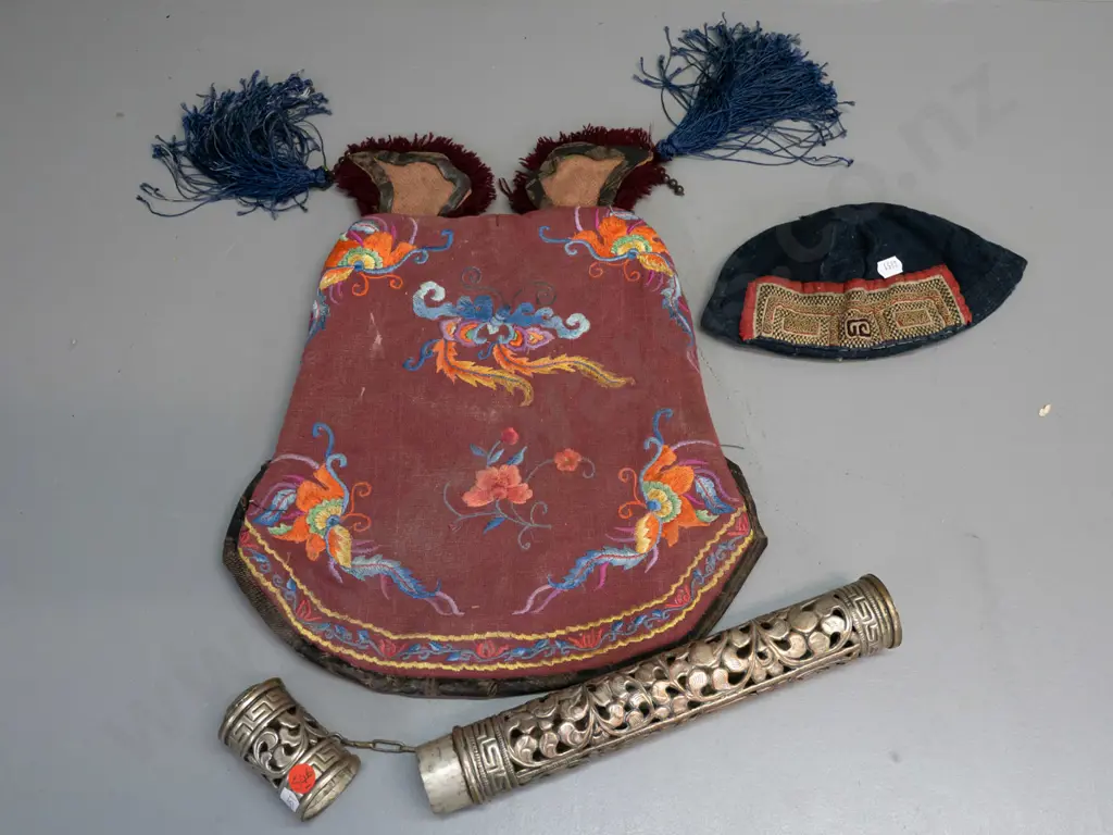 2 Chinese tribal style embroidered hats - small skullcap and larger with tasselled ears - and a pierced silver plated Image 1++