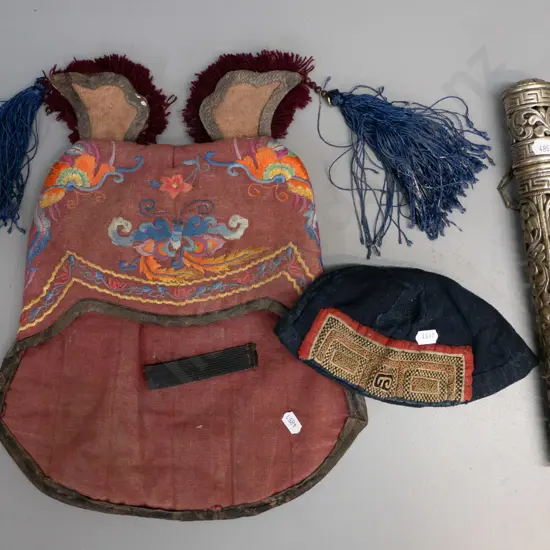 2 Chinese tribal style embroidered hats - small skullcap and larger with tasselled ears - and a pierced silver plated