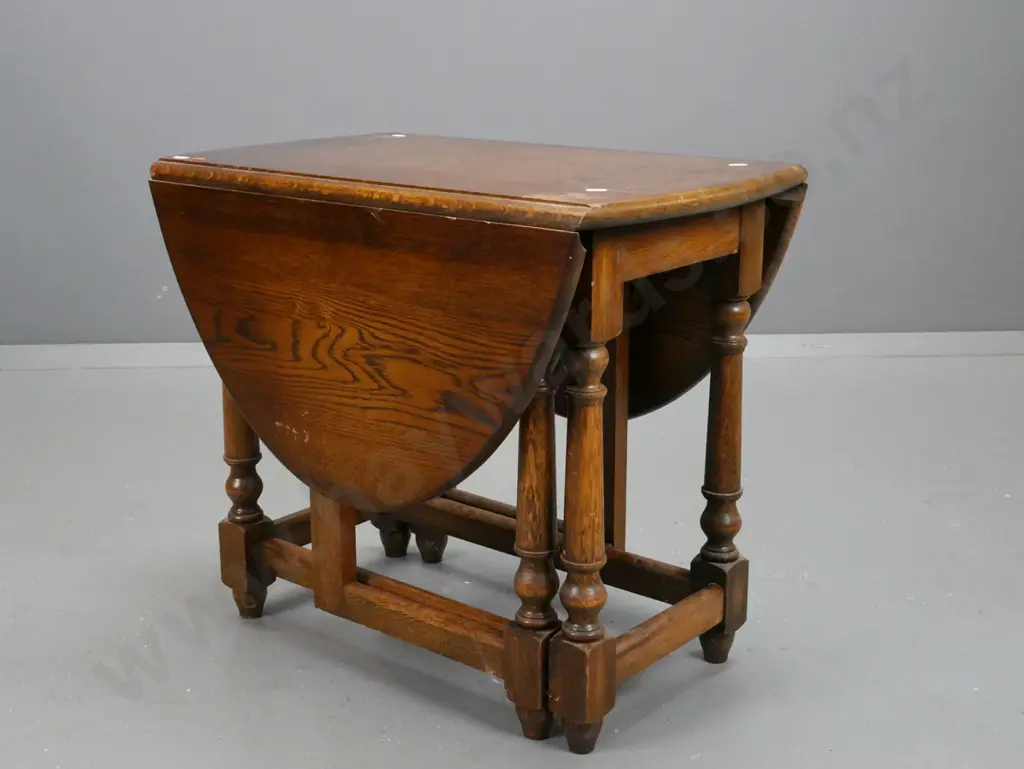 small oak vintage gate leg table with turned legs and supports on stretcher base. Scratching and wear Image 1++