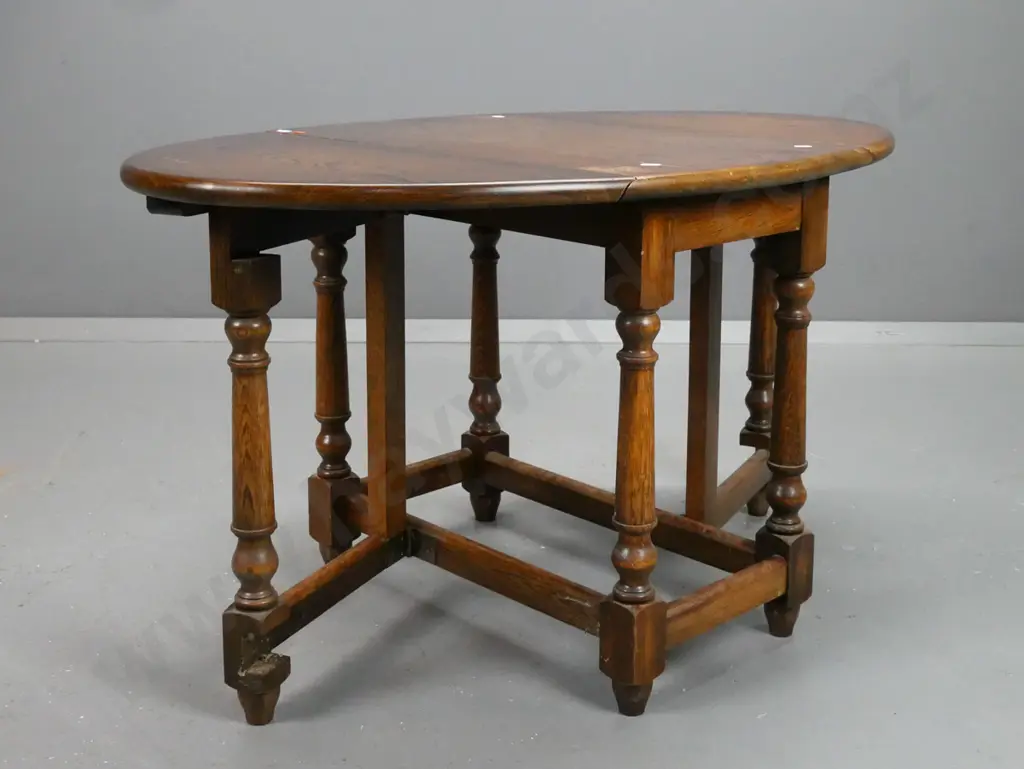 small oak vintage gate leg table with turned legs and supports on stretcher base. Scratching and wear Image 1++