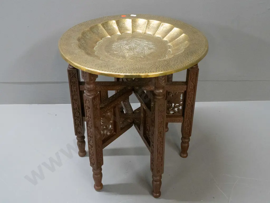 Indian brass tray table with fluted inner rim, floral etched motifs, sitting on folding carved hardwood base H-410 D-380 Image 1++