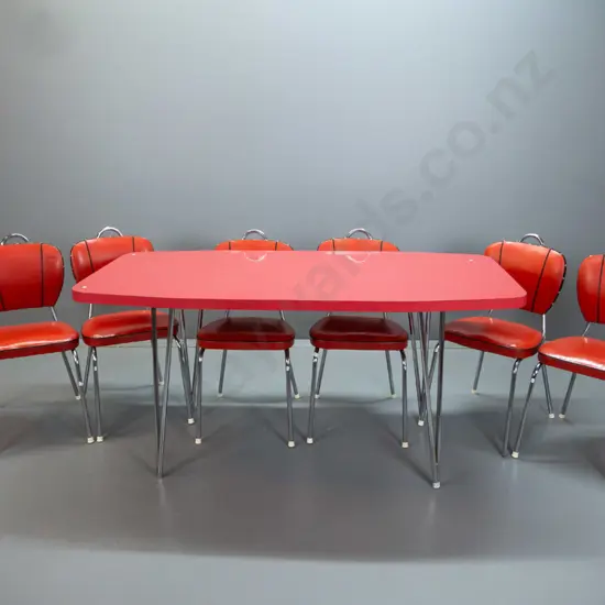 retro mid-century red formica table with chrome v-shaped legs, 6 vinyl and chrome chairs with black piping and studded