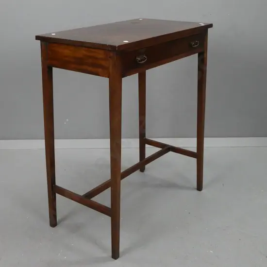 Victorian mahogany side table with square tapered legs and stretcher base, brass pierced-back handles. Repair to drawer