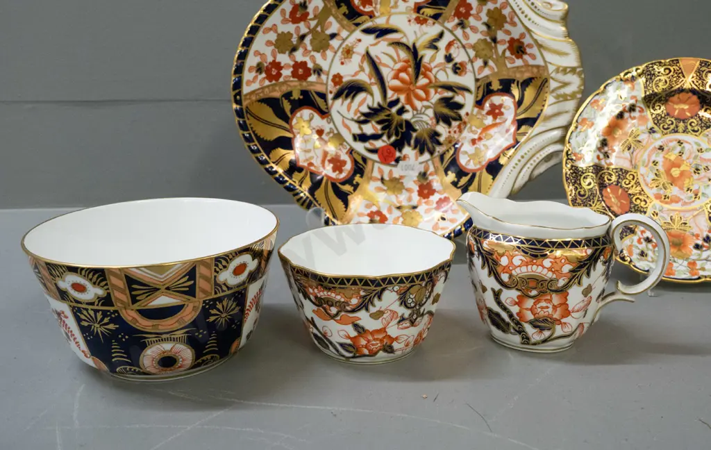 5 Royal Crown Derby items in varying imari patterns - single handled dish, saucer, jug and 2 bowls, plus a few pamphlets Image 1++