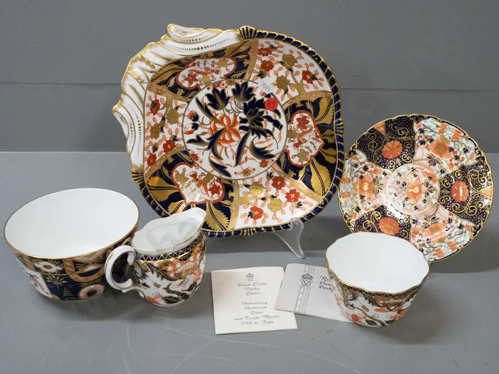 5 Royal Crown Derby items in varying imari patterns - single handled dish, saucer, jug and 2 bowls, plus a few pamphlets Image 1++