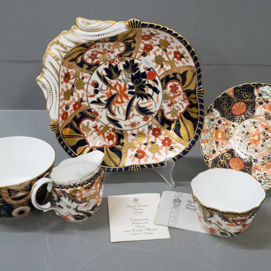 5 Royal Crown Derby items in varying imari patterns - single handled dish, saucer, jug and 2 bowls, plus a few pamphlets