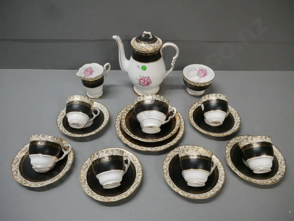 Royal Stafford black & gold leaf w/ pink rose 18-piece tea set: 6x duos & 1x trio, teapot, cream & sugar. Teapot H-180 Image 1++
