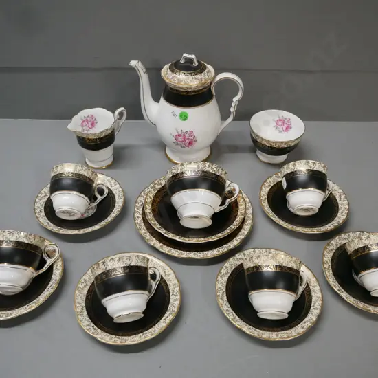 Royal Stafford black & gold leaf w/ pink rose 18-piece tea set: 6x duos & 1x trio, teapot, cream & sugar. Teapot H-180