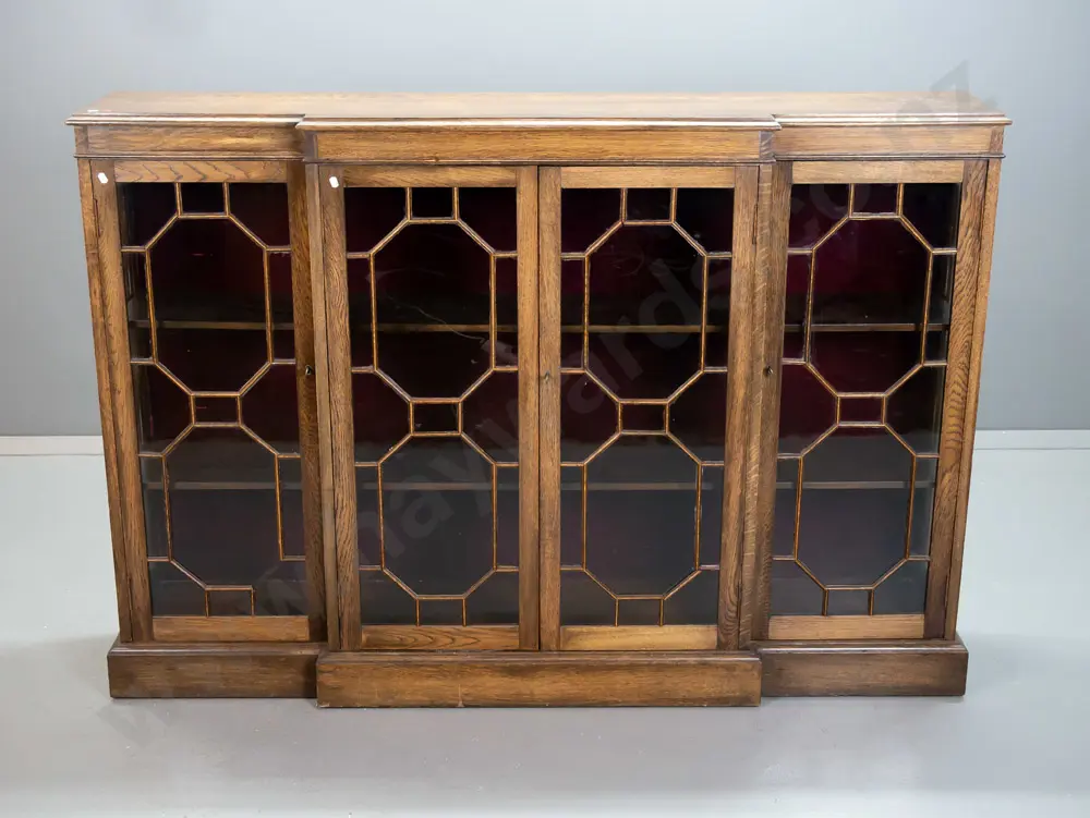 Edwardian oak break-front display cabinet with glazed sides, attached wooden astragals, 2 fixed shelves, red velvet back Image 1++